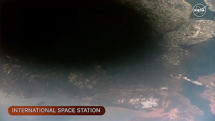 The Moon’s shadow, or umbra, on Earth was visible from the space station as it orbited into the path of the solar eclipse over southeastern Canada.