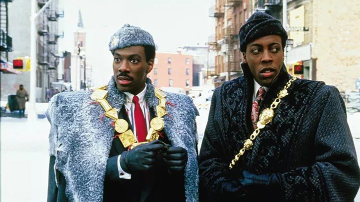 Eddie Murphy and Arsenio Hall dressed like royalty, standing in the street in New York in Coming to America.