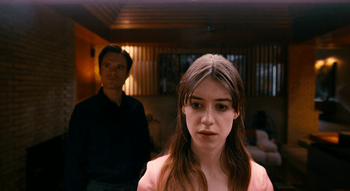 A man stands behind a woman in Fresh.