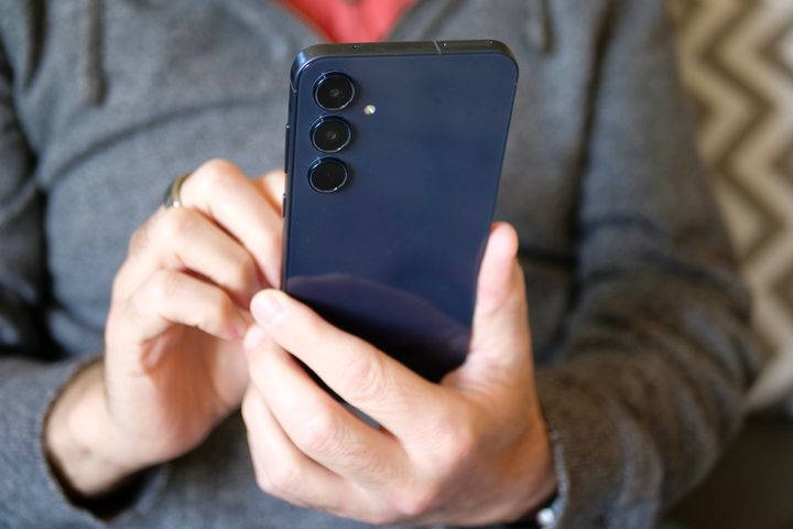 A person using the Samsung Galaxy A55.
