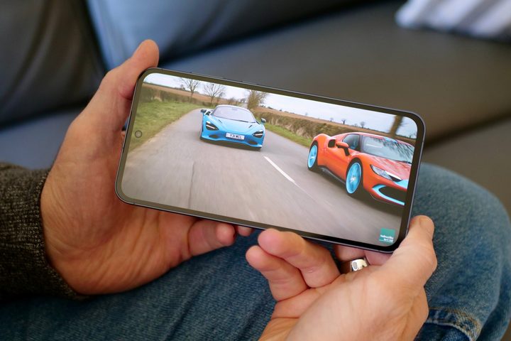 A person watching a video on the Samsung Galaxy A55.