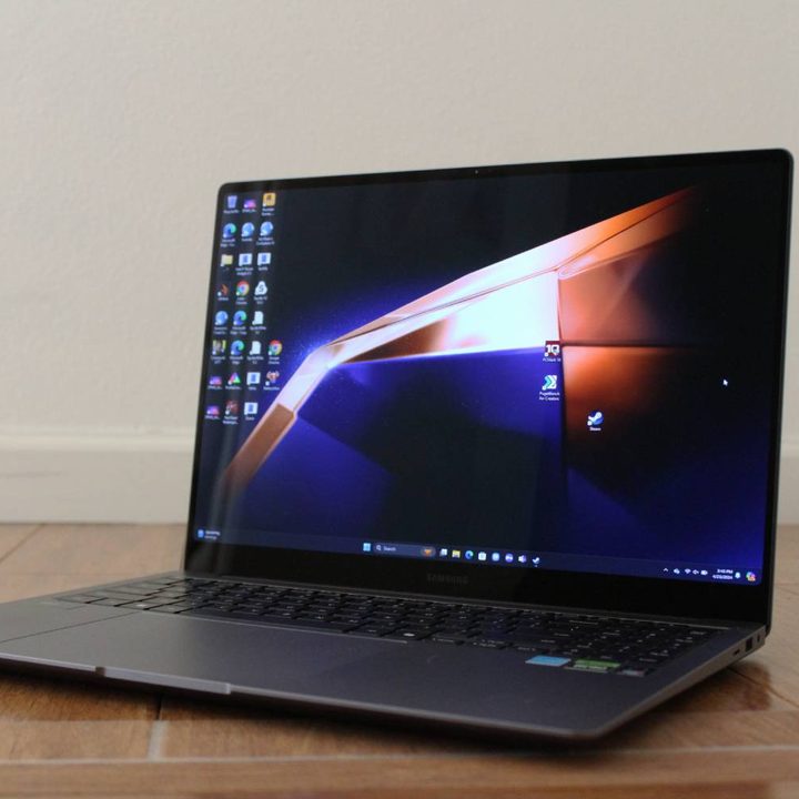 The Galaxy Book4 Ultra open on a wooden surface.