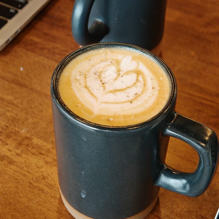 A photo of a coffee cup with a heart drawn on top, taken with the Honor Magic 6 RSR.