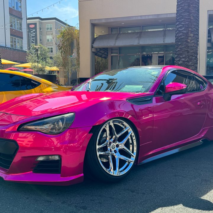 Hot pink Subaru.