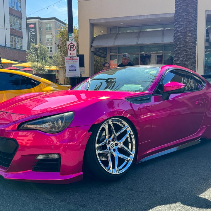 Hot pink Subaru.