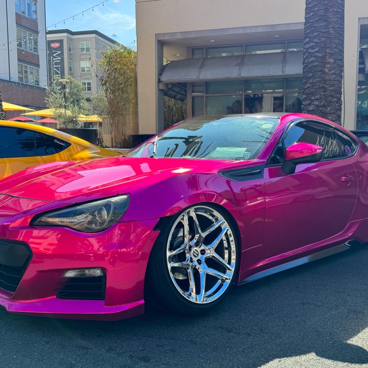 Hot pink Subaru.