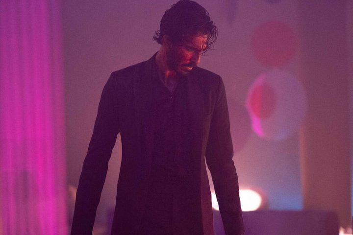 A blood-spattered, neon-lit Dev Patel in Monkey Man