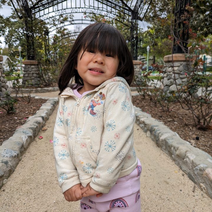Photo of toddler posing taken with Google Pixel 7a.
