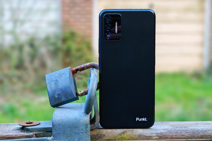 The Punkt MC02 next to a padlock.