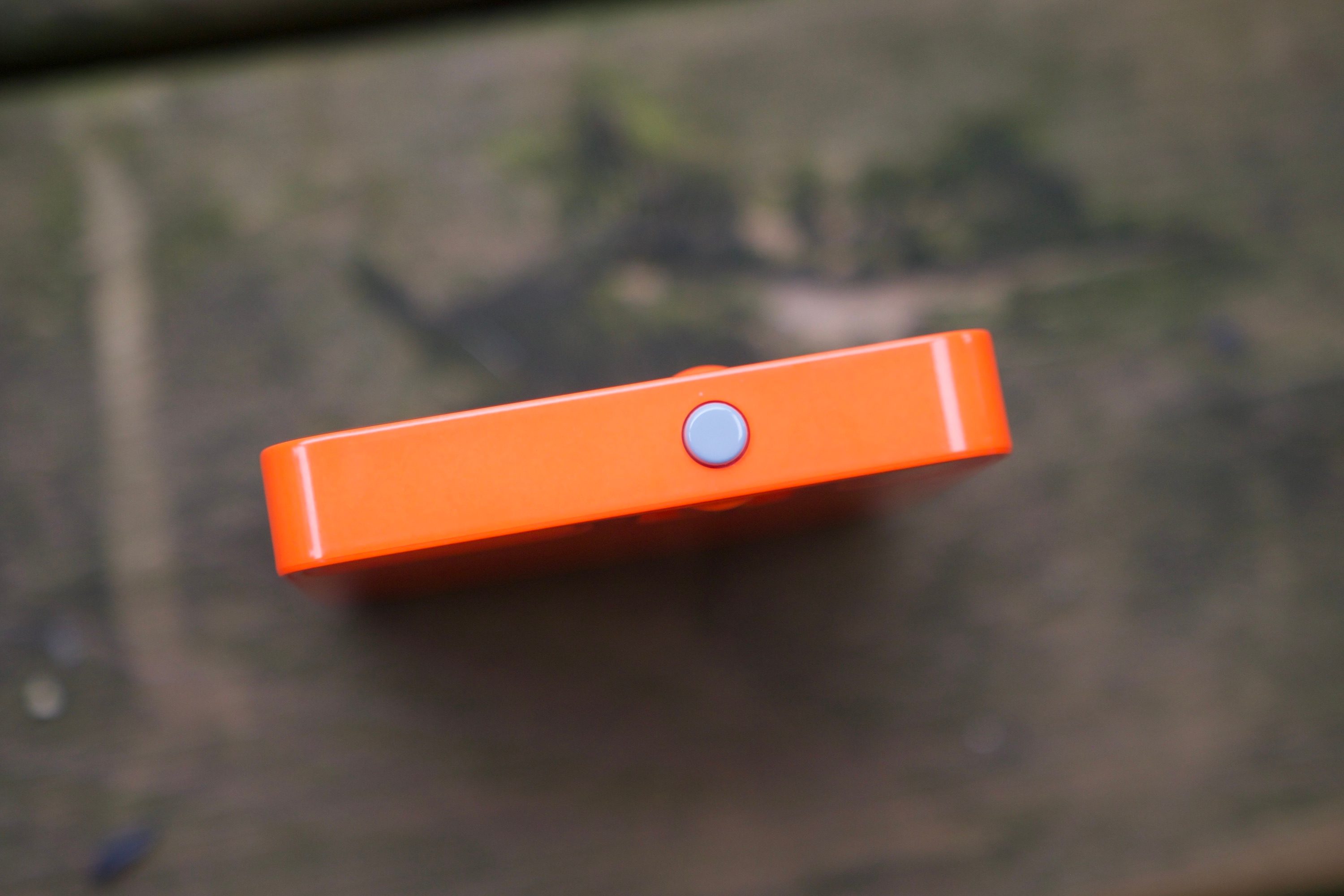 The gray button on the side of the Rabbit R1.
