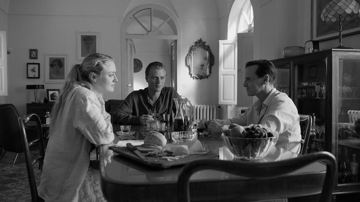 Three people sit around a table in Ripley.