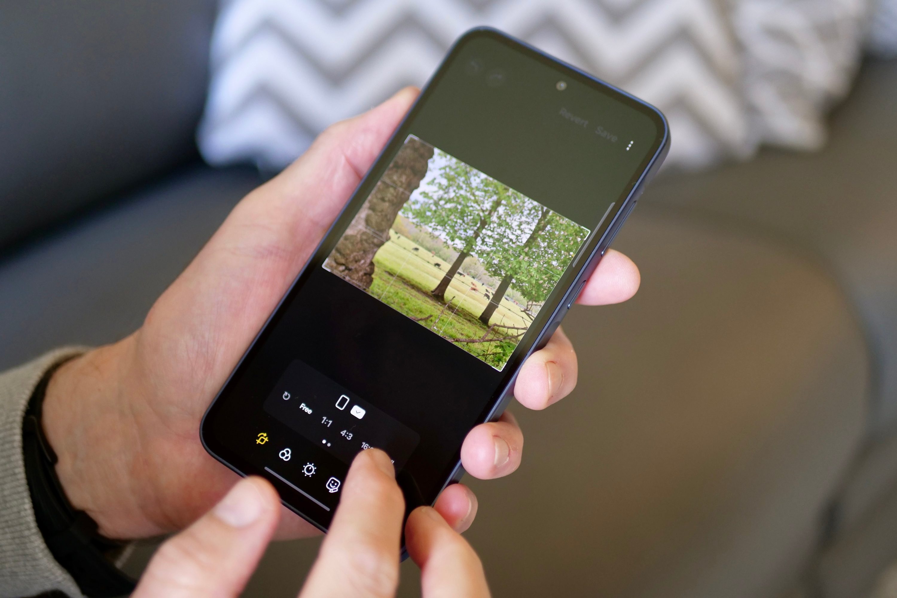 A person editing a photo on the Samsung Galaxy A35.