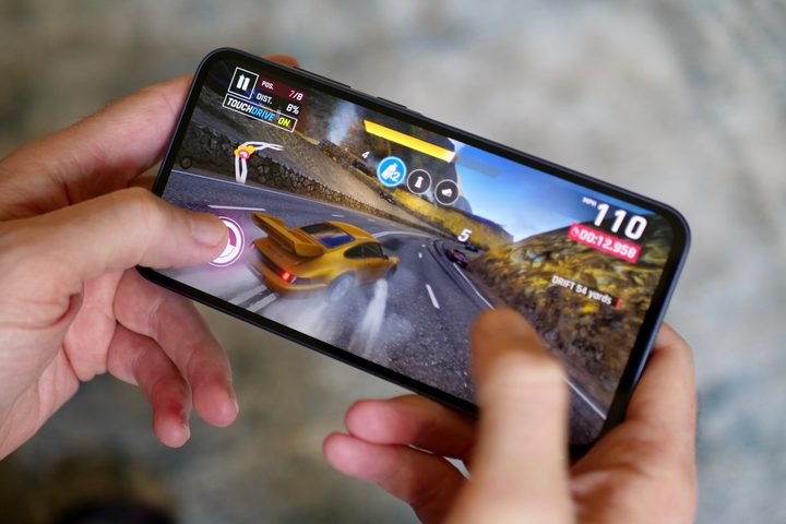 A person playing a game on the Samsung Galaxy A35.