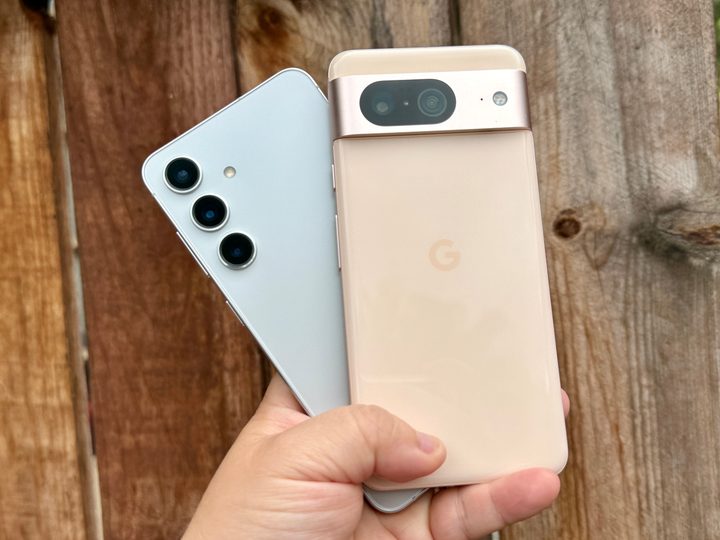 Samsung Galaxy S24 (left) and Google Pixel 8 in hand.