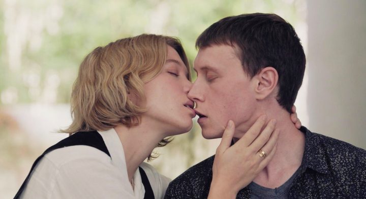 A woman kisses a man in The Beast.