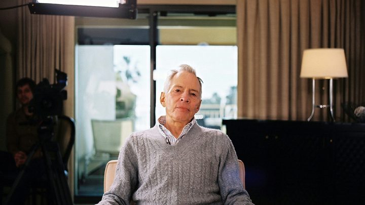 Robert Durst sitting in a chair being interviewed on The Jinx.