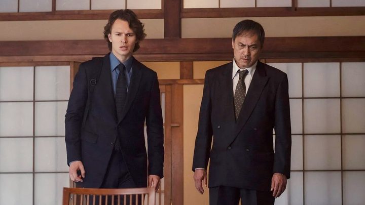 Two men stand in a house in Tokyo Vice.