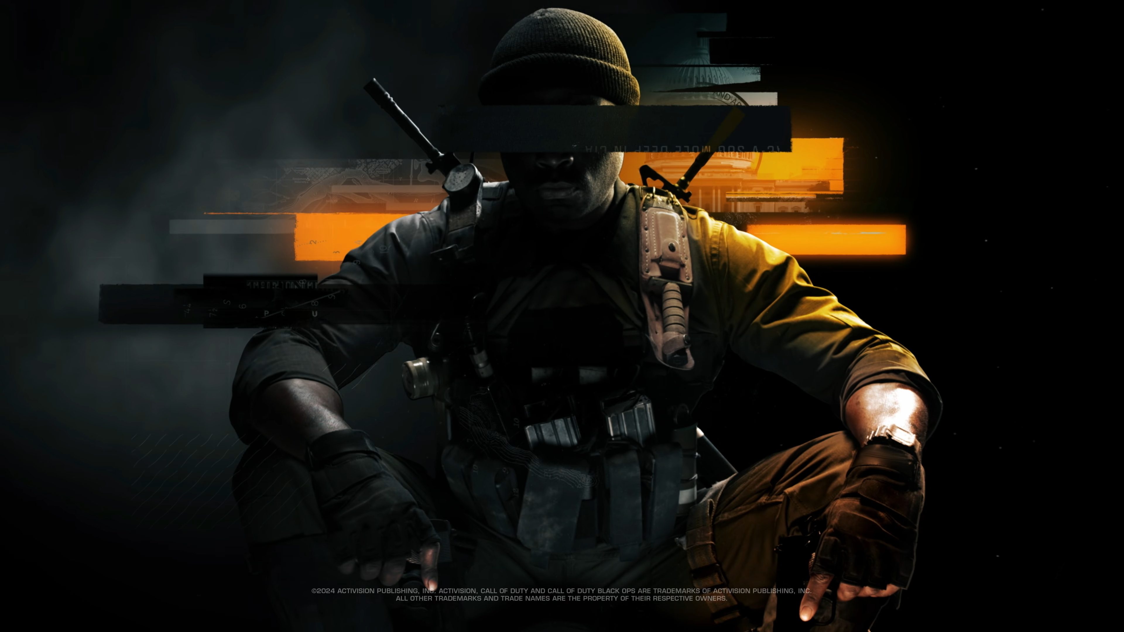 A soldier crouching with his eyes blacked out.