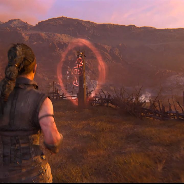 Senua approaching a lore totem in Hellblade 2.