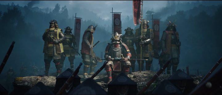 A samurai clan sitting under banners in Assassin's Creed Shadows.