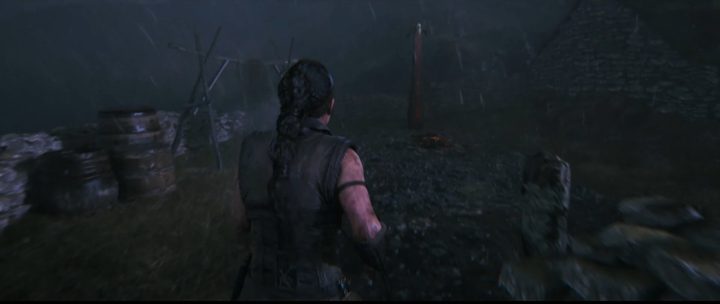 Senua approaching a lore totem in Hellblade 2.
