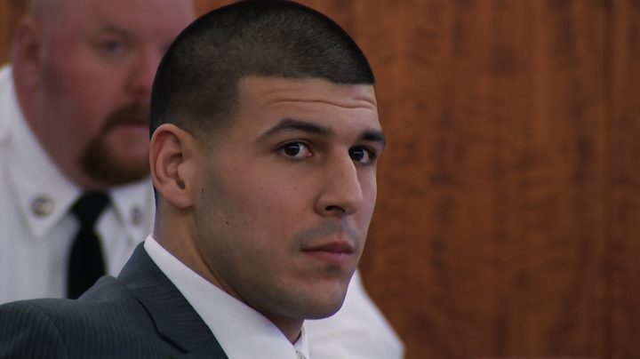 Aaron Hernadez stares coldly in a court room.