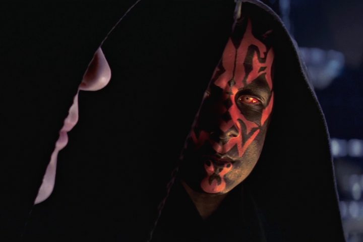 Darth Maul looks at Darth Sidious in Star Wars: Episode I - The Phantom Menace.