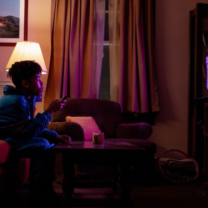 Ian Foreman watches TV in a still in I Saw the TV Glow.