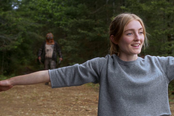 Johnny stands behind Aurora in In a Violent Nature.
