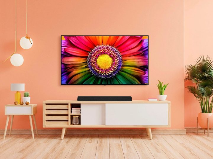 An LG Eclair 3.0 Channel Soundbar sitting on a table in a nice room.