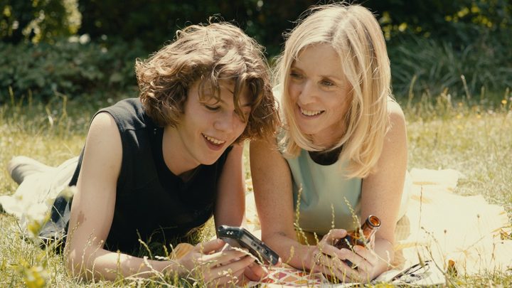 A woman and her stepson laugh in Last Summer.
