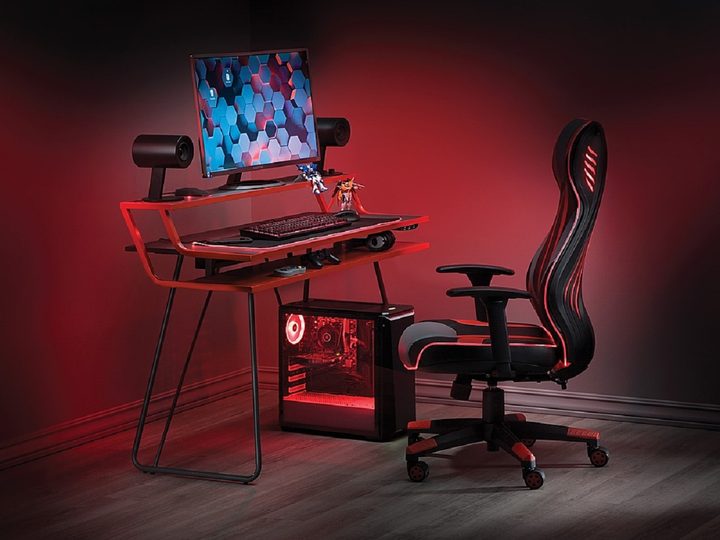 The OSP Home Furnishings Glitch Battlestation gaming desk with gaming PC.