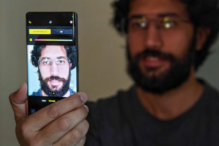 Vivo V30 Pro's Aura Light brightening a man's face.