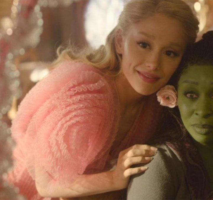 Ariana Grande hugs Cynthia Erivo in a still from the movie Wicked.