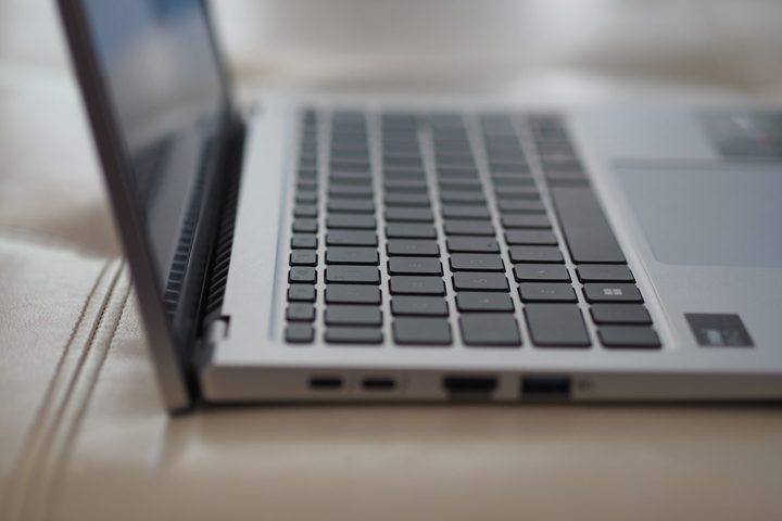Acer Swift Go 14 side view showing lid, keyboard, and ports.