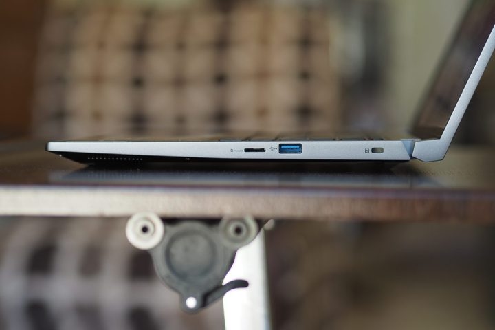 Acer Swift X 14 2024 side view showing ports and lid.