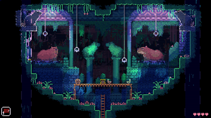 A blob stands in a room full of capybara in Animal Well.