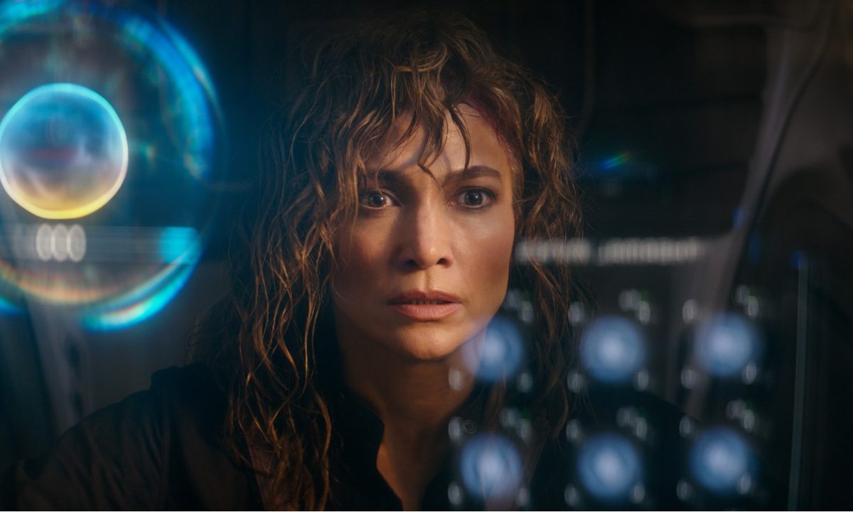 A woman looks at an AI interface in Atlas.