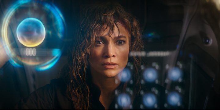 A woman looks at an AI interface in Atlas.