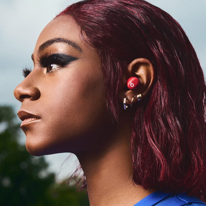 Track star Sha'Carri Richardson wearing the red Beats Solo Buds.