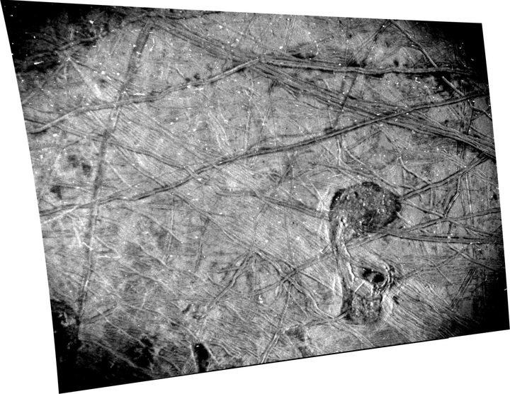 This black-and-white image of Europa's surface was taken by the Stellar Reference Unit (SRU) aboard NASA's Juno spacecraft during a Sept. 29, 2022, flyby of the Jovian moon.