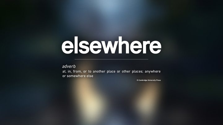 The logo for Elsewhere Entertainment. It's on a gradient background and under the name it says "adverb: at, in, from, or to another place or other places; anywhere or somewhere else."
