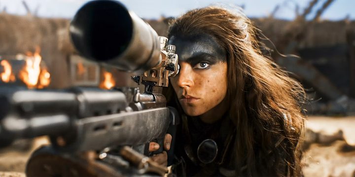 Furiosa aims her rifle in "Furiosa: A Mad Max Saga."