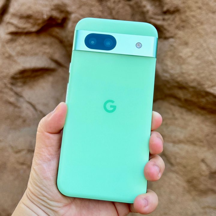 A person holding the Google Pixel 8a
