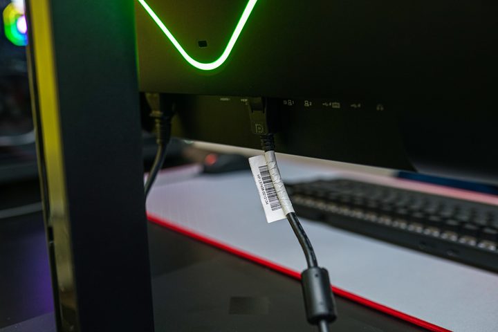 Cables connected to the HP Omen 27k monitor.
