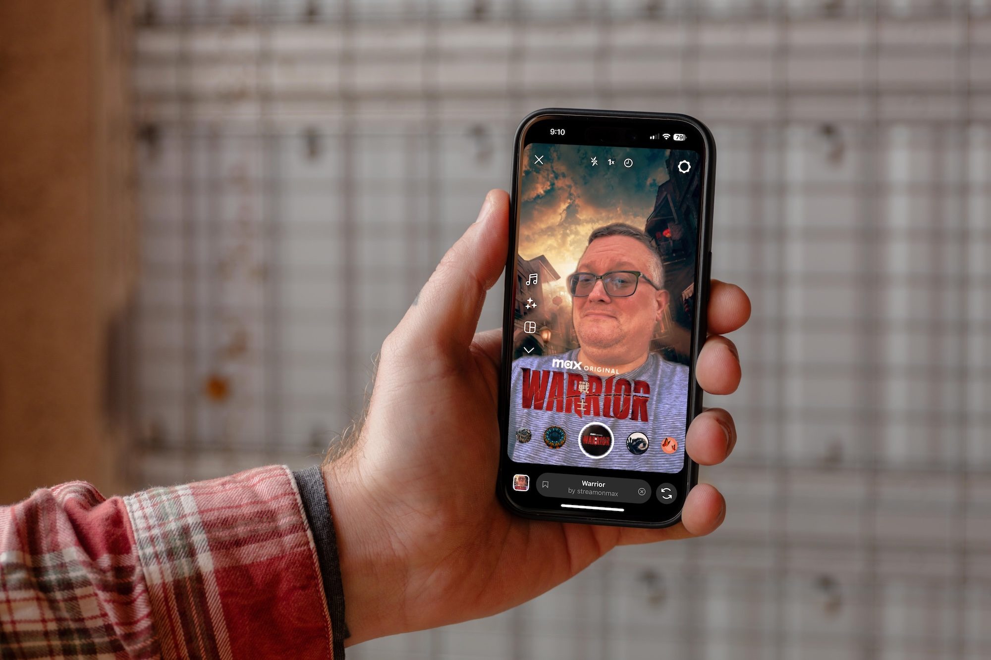 a hand holding an iPhone with the Instagram app showing.