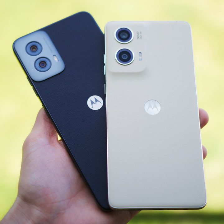 Someone holding the Moto G Power 5G (2024) and Moto G Stylus 5G (2024).
