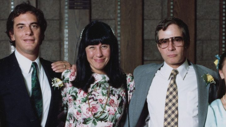 Three people stand at a wedding in The Jinx: Part Two.
