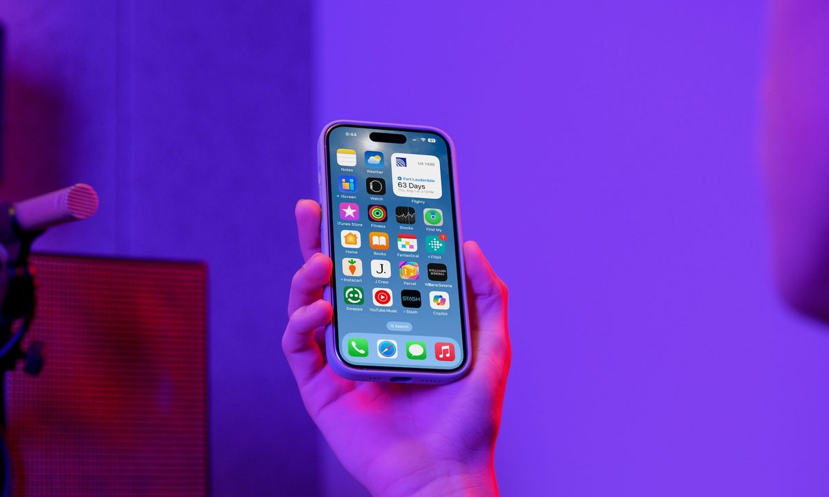 person holding an iphne 15 pro max.