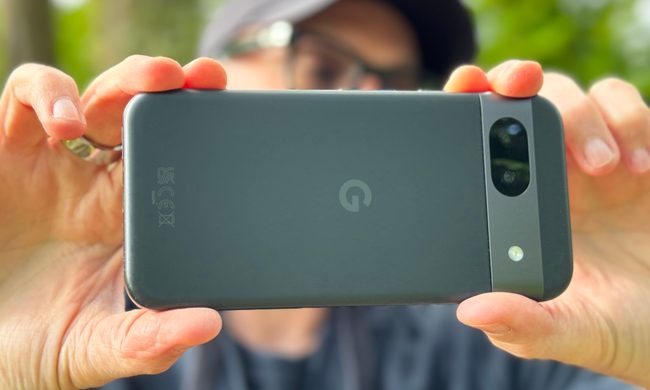 A person taking a photo with the Google Pixel 8a.